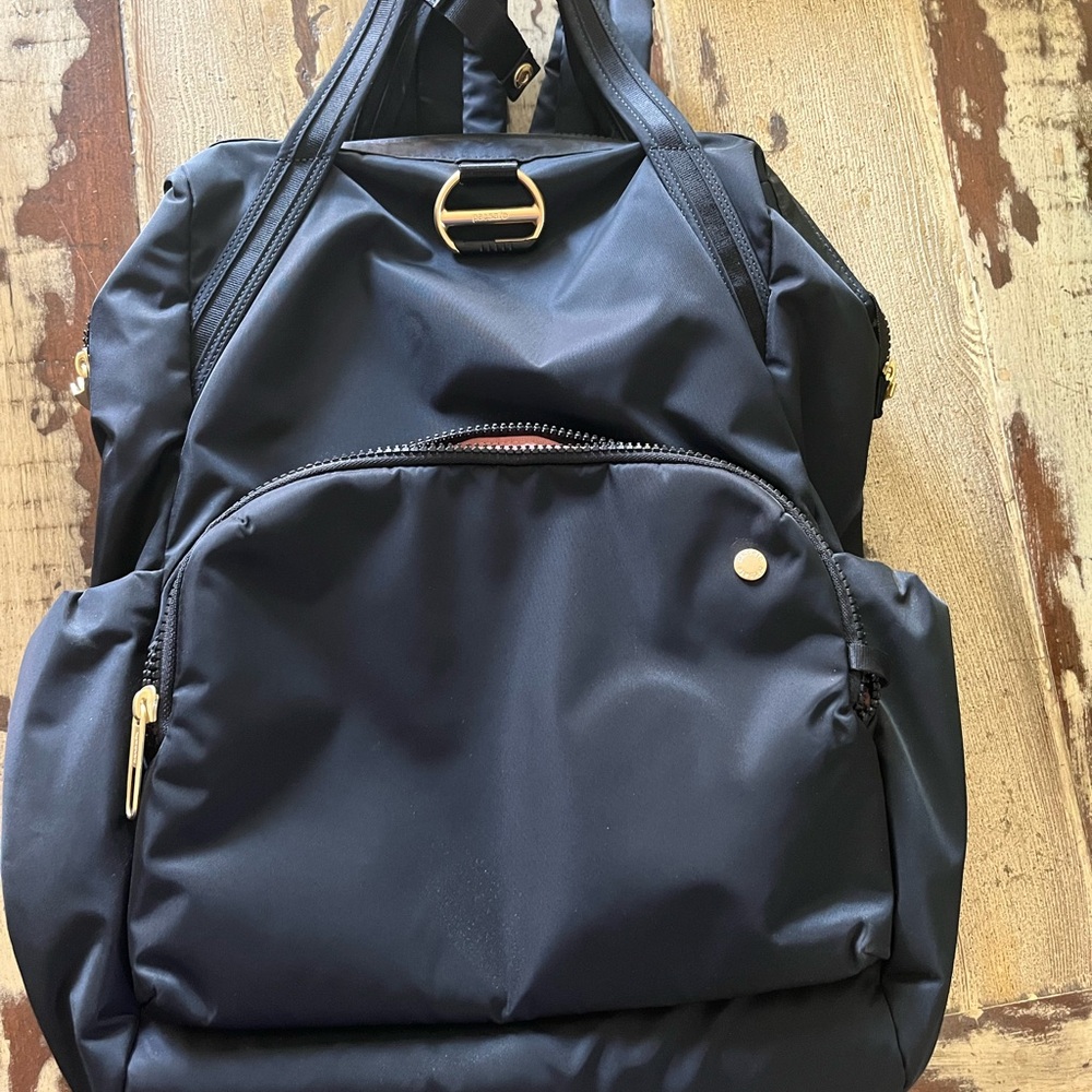 Pacsafe Black Backpack with Gold Accents